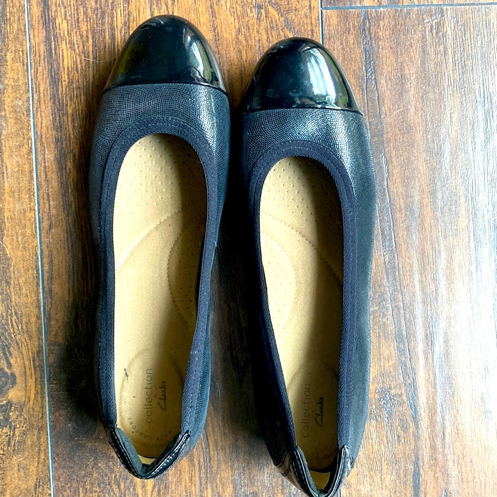 Clarks black flats with patent toe